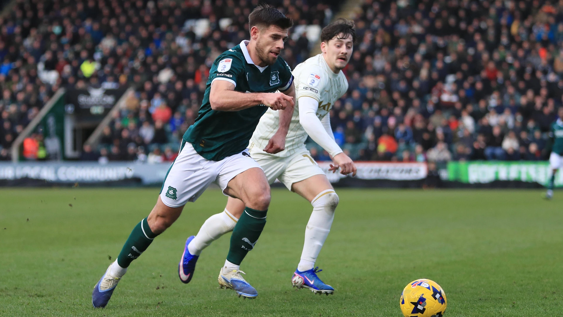 Joe Edwards of Plymouth Argyle battles for the ball with Dylan Williams of Burton Albion during the SKY Bet League 1 match between Plymouth Argyle and Burton Albion on 4 January 2026