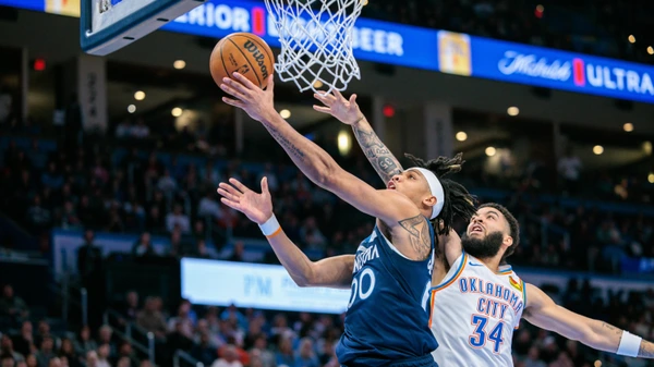 Terrence Shannon Jr. #00 of the Minnesota Timberwolves shoots the ball around Kenrich Williams #34 of the Oklahoma City Thunder during the fourth quarter at Paycom Center on February 24, 2025 in Oklahoma City, Oklahoma.