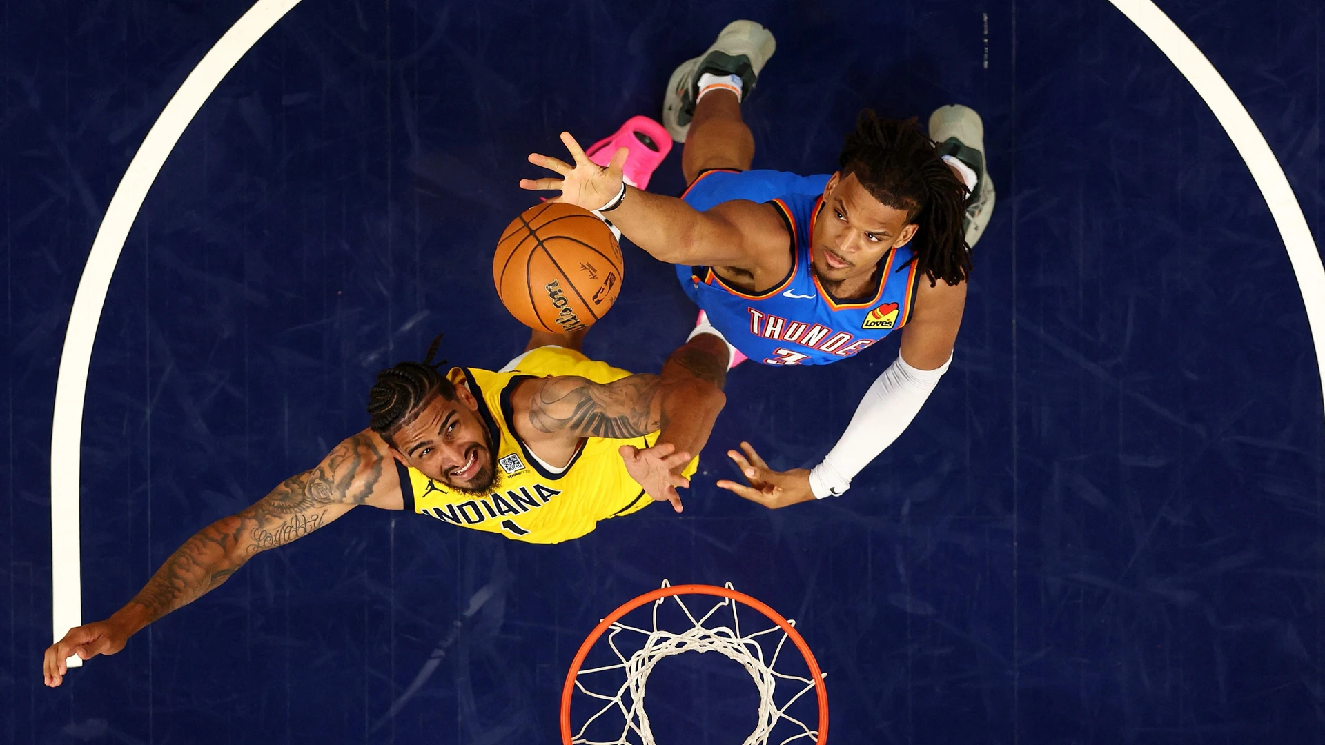 Dillon Jones #3 of the Oklahoma City Thunder and Obi Toppin #1 of the Indiana Pacers fight for a rebound during the fourth quarter in Game Six of the 2025 NBA Finals at Gainbridge Fieldhouse on June 19, 2025 in Indianapolis, Indiana.