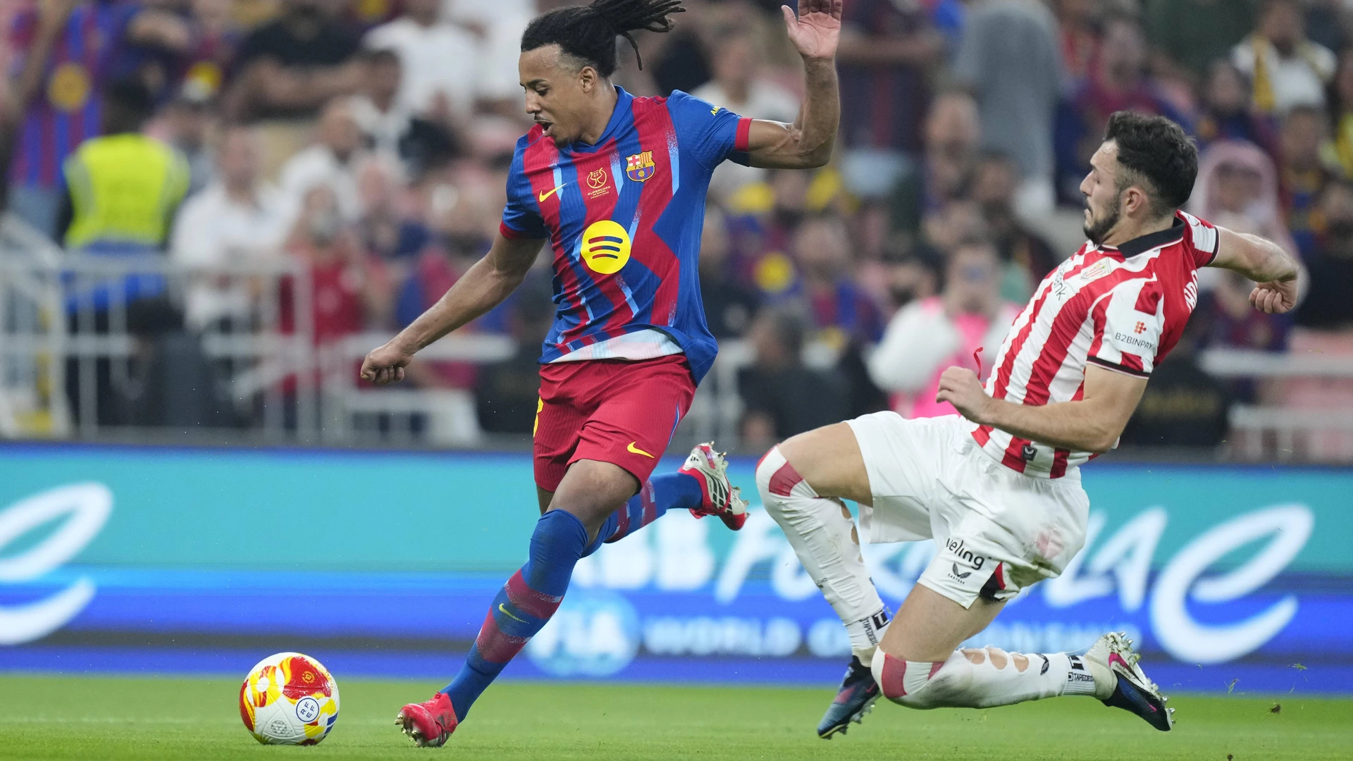 Jules Kounde centre-back of Barcelona and Aitor Paredes centre-back of Athletic Club compete for the ball during the Spanish Super Cup semi-final match between FC Barcelona, Barca and Athletic Club on January 7, 2026 in Jeddah, Saudi Arabia.