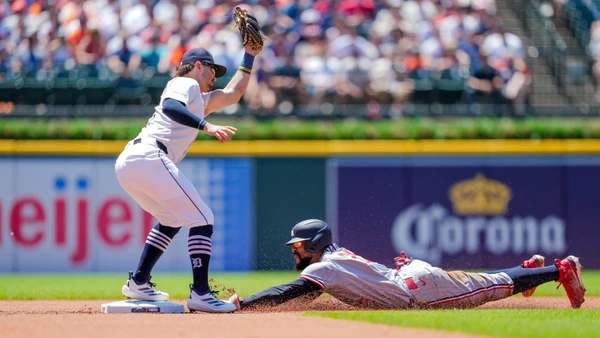 Byron Buxton #25 of the Minnesota Twins steals second base against Zach McKinstry #39 of the Detroit Tigers  June 28, 2025 in Detroit, Michigan.