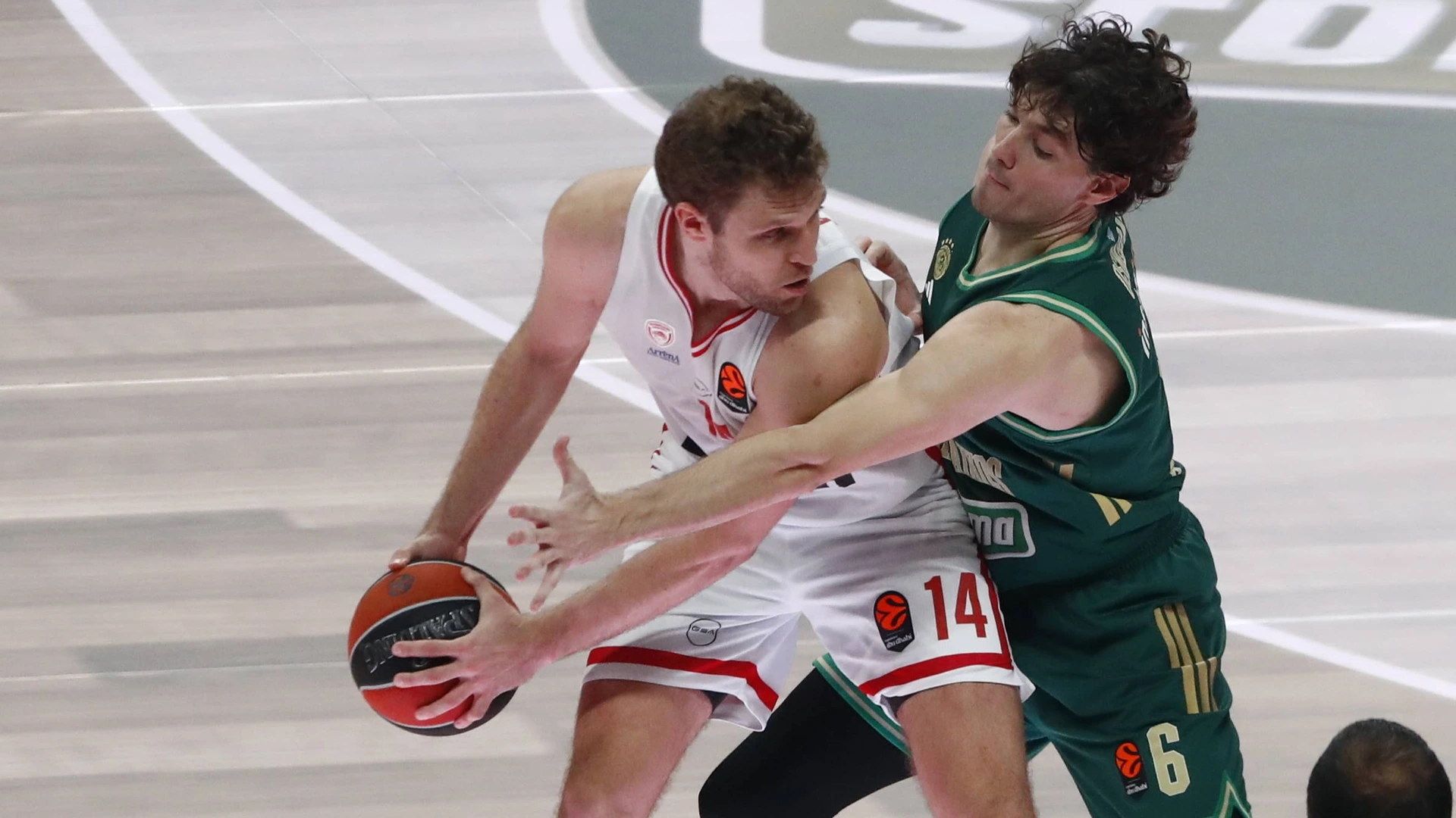 Sasha Vezenkov, 14 of Olympiacos competes with Cedi Osman, 6 of Panathinaikos during the EuroLeague match between Panathinaikos Athens and Olympiacos Piraeus on January 02, 2026