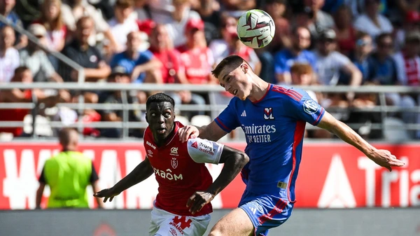 Mohamed DARAMY of Reims and Jake O'BRIEN of Lyon during the French championship Ligue 1 football match between Stade de Reims and Olympique Lyonnais on October 1, 2023