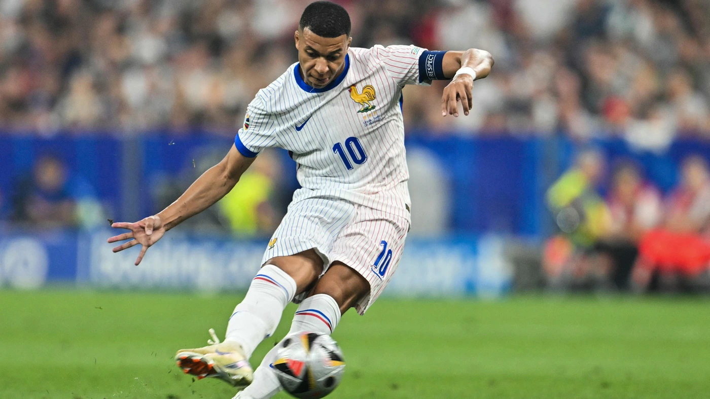 France's forward #10 Kylian Mbappe attempts a shot during the UEFA Euro 2024 semi-final football match between Spain and France at the Munich Football Arena in Munich on July 9, 2024.