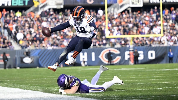 CHICAGO, ILLINOIS - NOVEMBER 24: Caleb Williams #18 of the Chicago Bears is forced out of bounds during the first quarter against the Minnesota Vikings at Soldier Field on November 24, 2024 in Chicago, Illinois.