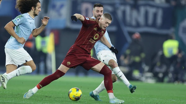 Roma's Ukrainian forward Artem Dovbyk challenges for the ball with Lazioâs Spanish defender Mario Gila during the Serie A football match between AS Roma vs SS Lazio at the Olimpico Stadium in Rome, Italy on January 05, 2025.