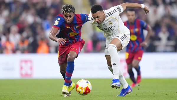 Kylian Mbappe centre-forward of Real Madrid and France and Lamine Yamal right winger of Barcelona and Spain compete for the ball during the Spanish Super Cup final match between FC Barcelona and Real Madrid at King Abdullah Sports City Hall Stadium on January 11, 2026