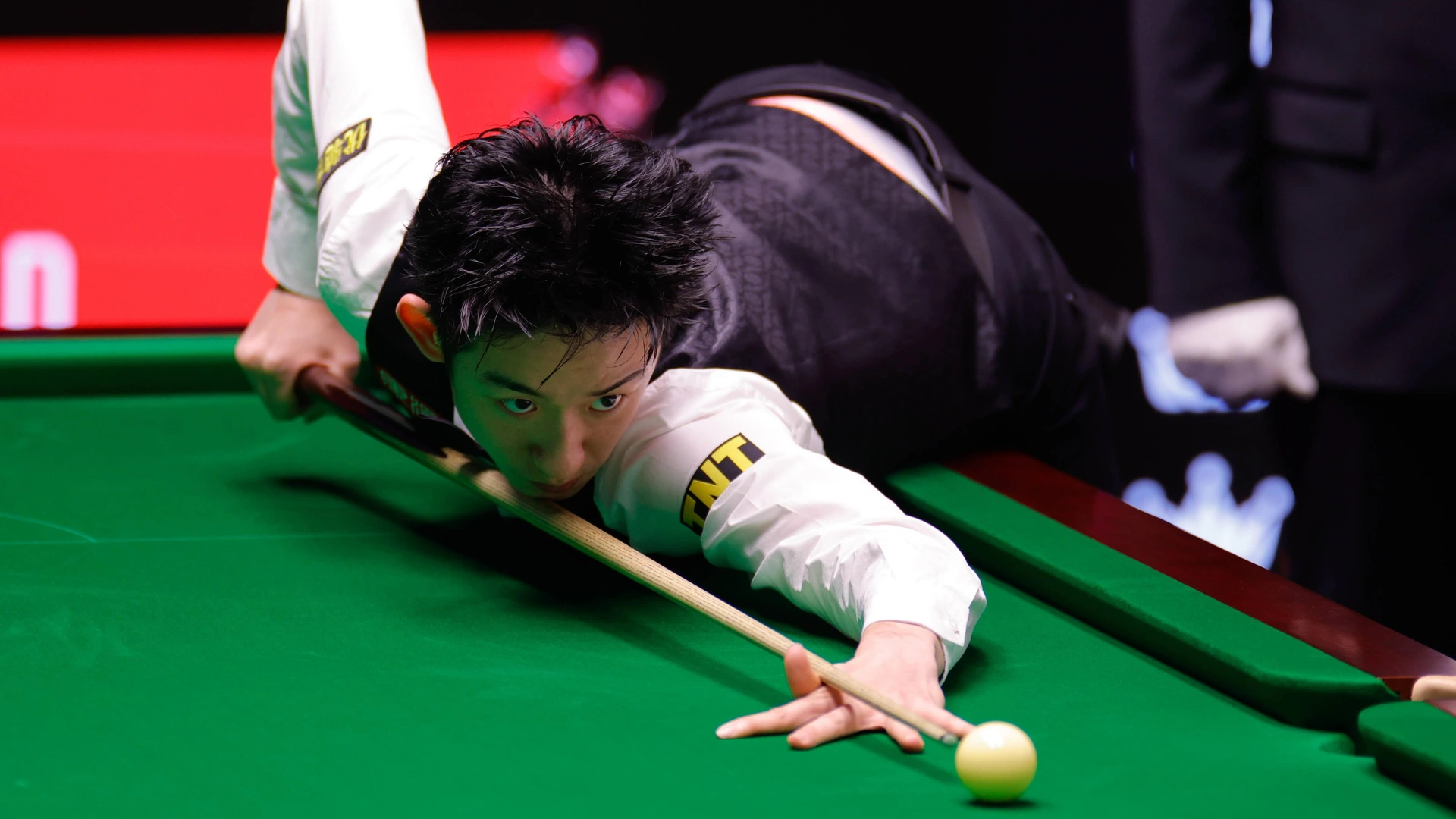 SHEFFIELD, ENGLAND - APRIL 28: Wu Yize of China plays a shot in the Quarterfinal match against Hossein Vafaei of Iran on day 11 of Halo World Championship,  2026 at Crucible Theatre on April 28, 2026 in Sheffield, England.