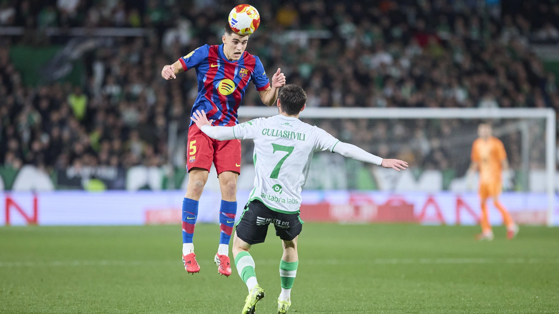 Pau Cubarsi of FC Barcelona competes for the ball with Giorgi Guliashvili of Real Racing Club during the Copa del Rey round of 16 match between Real Racing Club Santander and FC Barcelona at Campos de El Sardinero on January 15, 2025