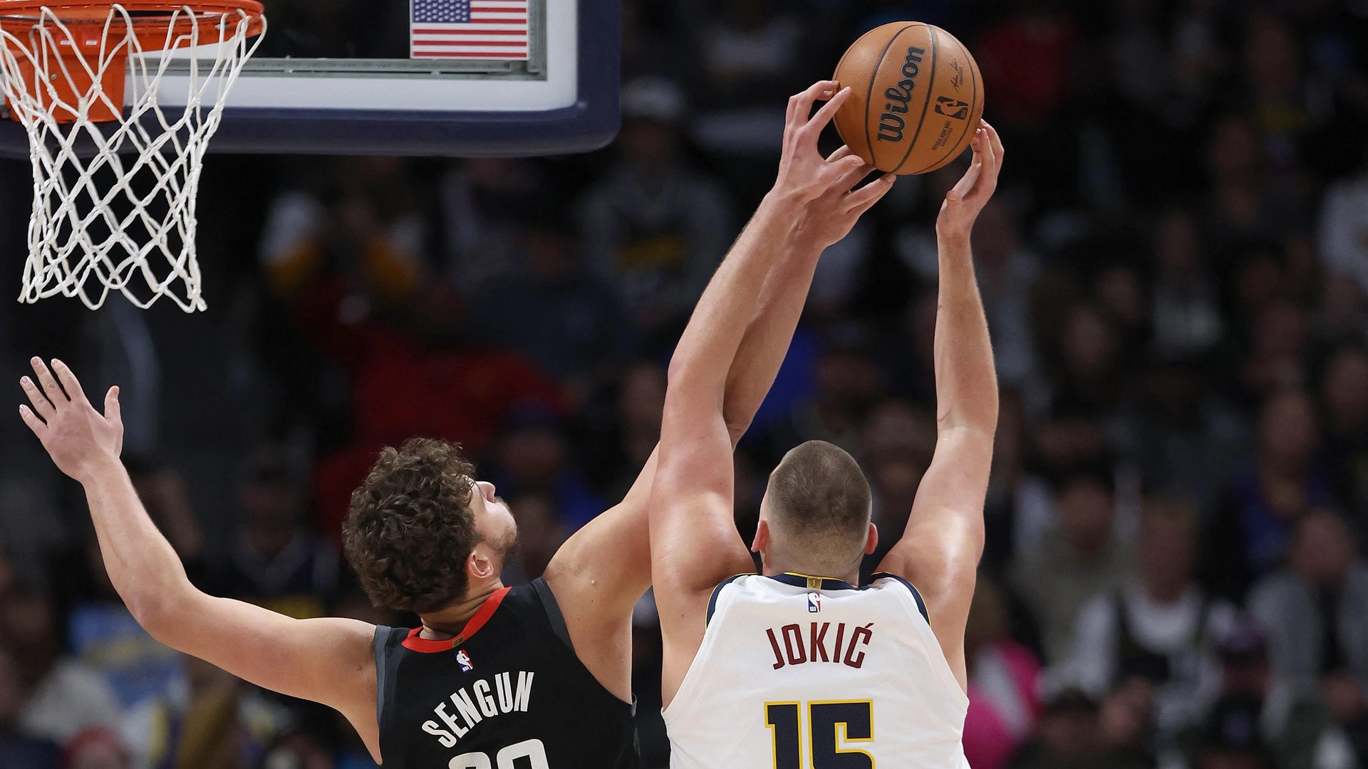 DENVER, COLORADO - DECEMBER 08: Nikola Jokic #15 of the Denver Nuggets goes to the basket against Alperen Sengun #28 of the Houston Rockets in the third quarter at Ball Arena on December 08, 2023 in Denver, Colorado.