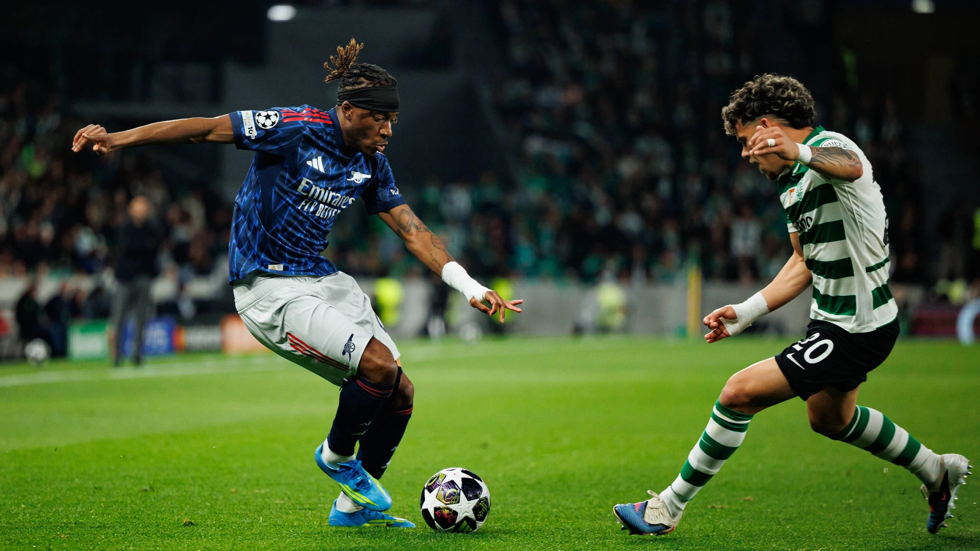 Noni Madueke and Maximiliano Araujo seen during UEFA Champions League quarterfinal game between teams of Sporting CP and Arsenal FC at Estadio Jose Alvalade