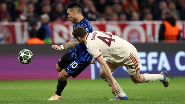 Lautaro Martinez of Inter R and Josip Stanisic of FC Bayern Munich F battle for the ball during the UEFA Champions League 2024/25 quarter-final first leg match between FC Bayern Munchen and FC Internazionale at Allianz Arena on April 8, 2025