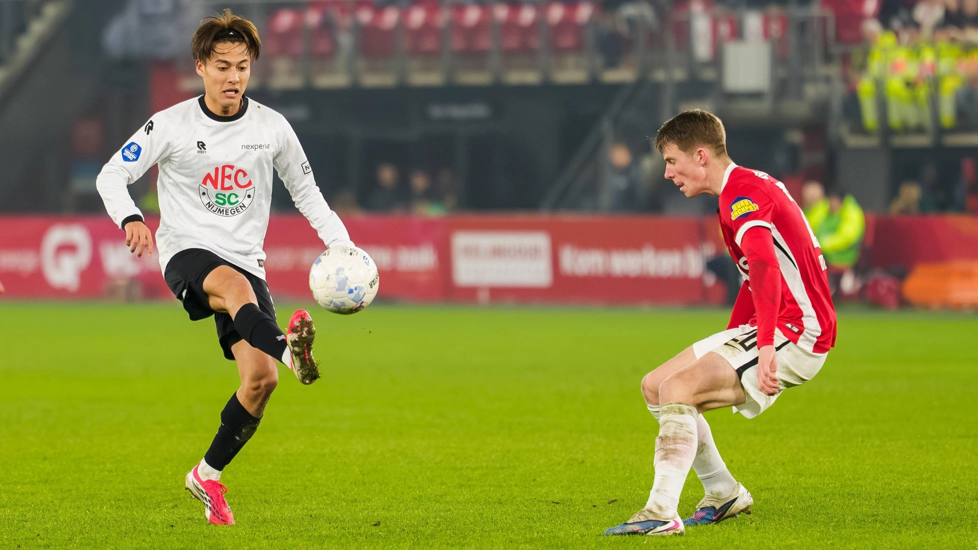 ALKMAAR , 31-01-2026 , AFAS stadium , season 2025 / 2026 , Dutch Eredivisie football , match between AZ and NEC Nijmegen , Picture shows NEC player Kodai Sano and AZ player Kasper Boogaard