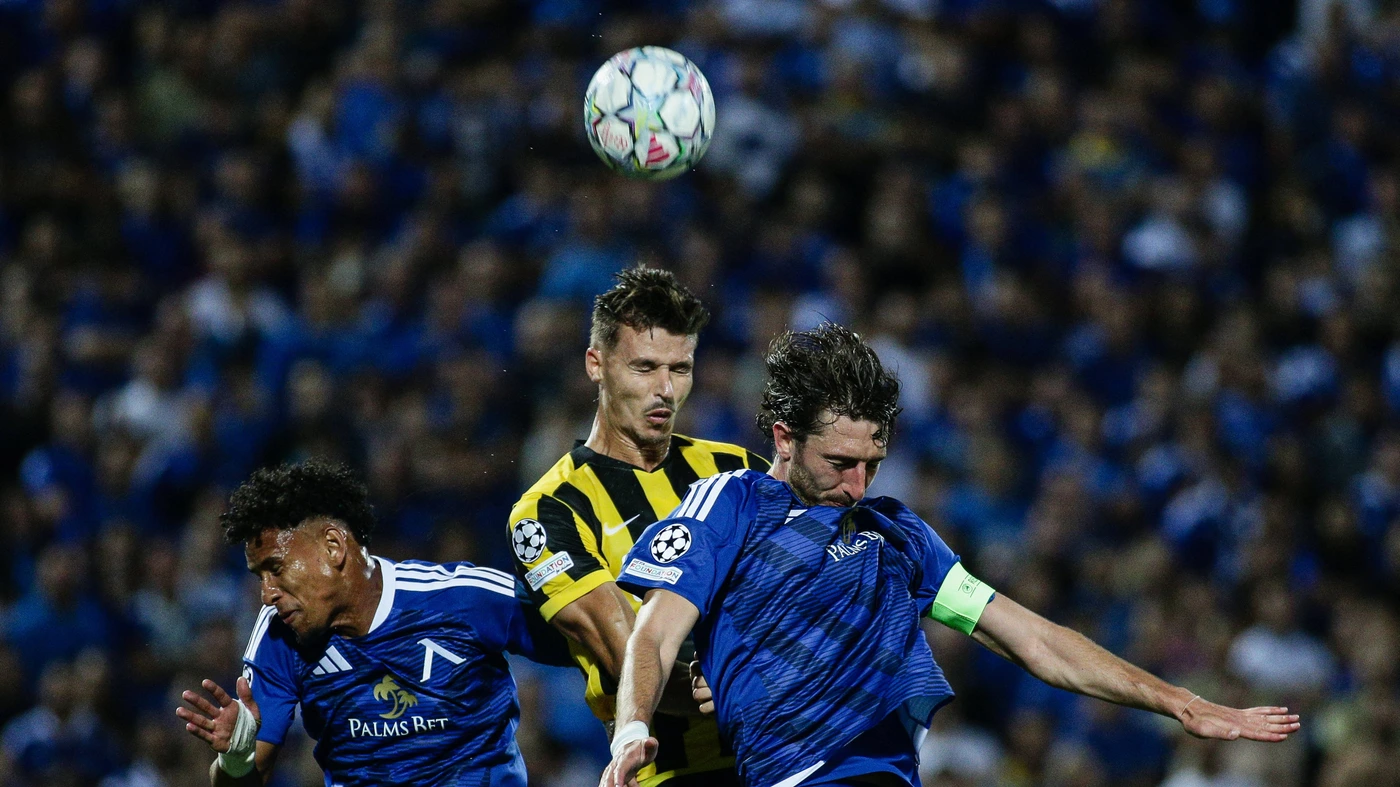 Levski s Kristian Dimitrov and Reinaldo in action against AEK s Filipe Relvas during the Champions League playoff match between PFC Levski Sofia and AEK Athens FC at Vasil Levski Stadium in Sofia, Bulgaria, on August 18, 2026