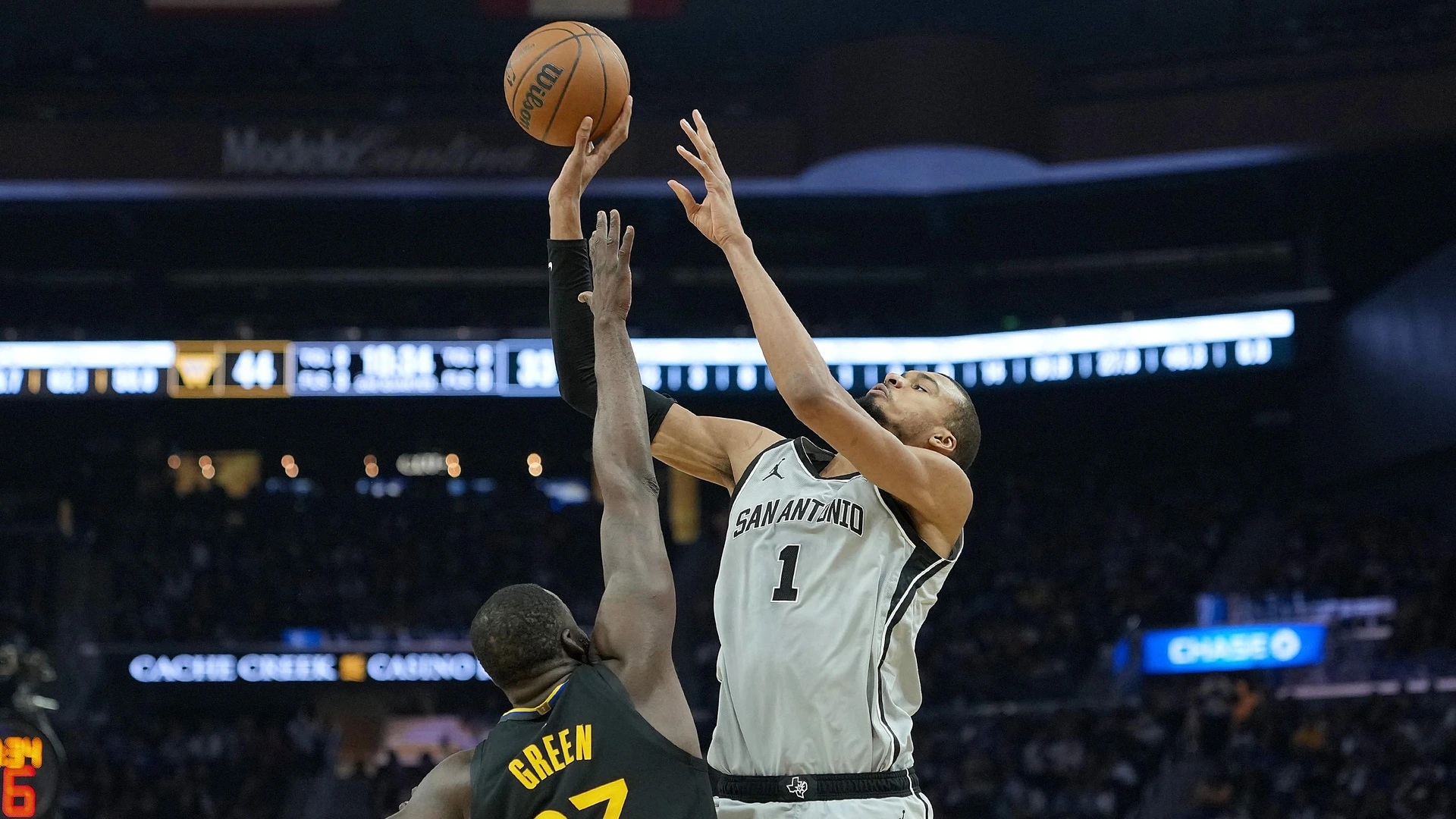 SAN FRANCISCO, CALIFORNIA - FEBRUARY 11: Victor Wembanyama #1 of the San Antonio Spurs is fouled while shooting by Draymond Green #23 of the Golden State Warriors in the first half at Chase Center on February 11, 2026 in San Francisco, California.