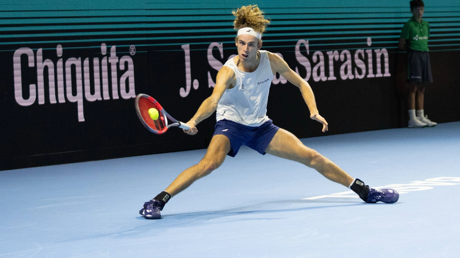 Mika Brunold of Switzerland stretches to hit a forehand against Jaime Faria of Portugal during Day 1 of the Swiss Indoors Basel at St. Jakobshalle on October 24, 2026