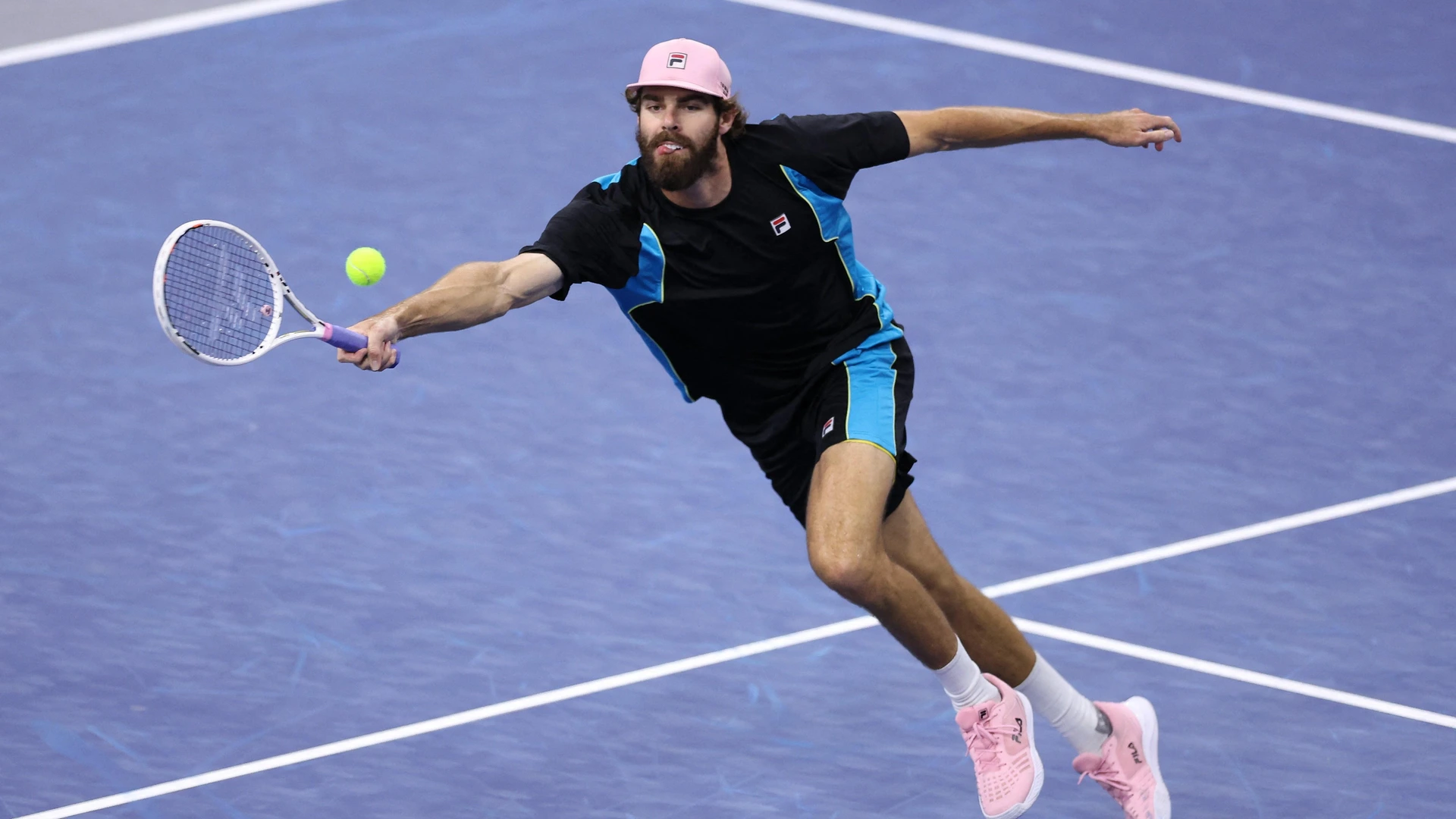 Reilly Opelka of the United States plays a shot against Tommy Paul of the United States in the Men's Singles Quarterfinals match during day five of the 2025 Dallas Open at The Ford Center at The Star on February 07, 2025 in Frisco, Texas.