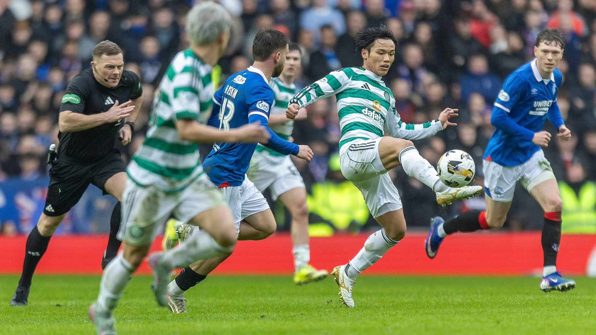 Rangers v Celtic, William Hill Scottish Premiership Reo Hatate of Celtic FC flicks the ball over the defensive line during the William Hill Scottish Premiership. Rangers FC vs Celtic FC, Ibrox Stadium, Glasgow, Scotland 1 March 2026.