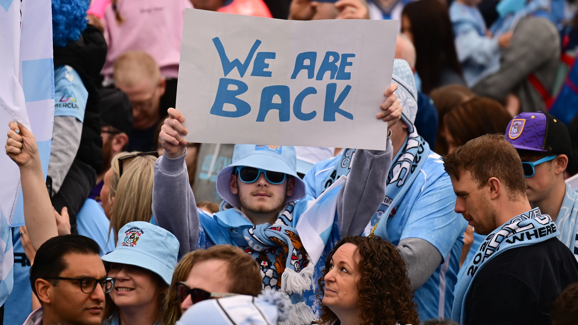Coventry City Promotion Parade 04MAY2026 Coventry City fan holds his we are back poster during the Promotion Parade for Coventry City at the Coventry Building Society Arena, Coventry, UK on 4 May 2026.