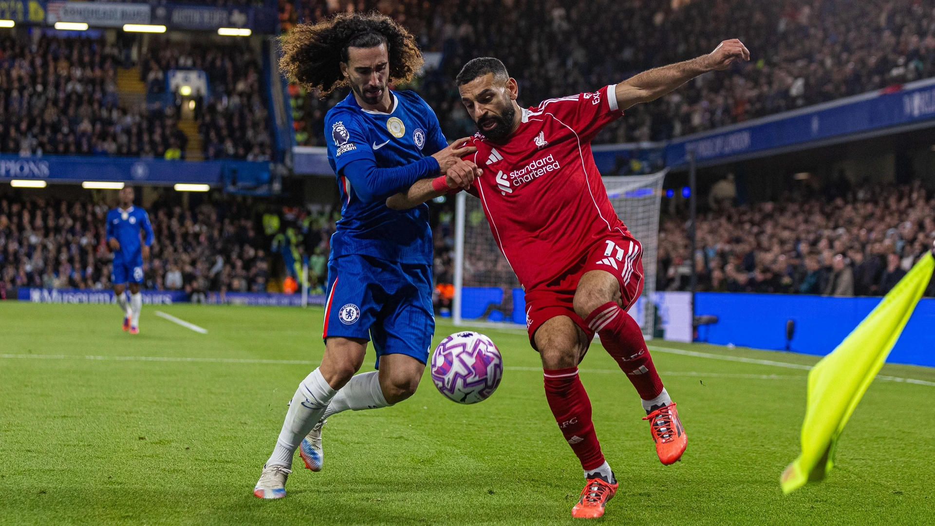 251005 -- LONDON, Oct. 5, 2025 -- Chelsea s Marc Cucurella L challenges Liverpool s Mohamed Salah during the English Premier League match between Chelsea FC and Liverpool FC in London, Britain, on Oct. 4, 2025.