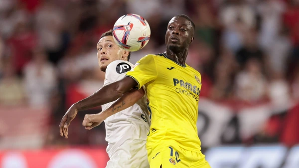 Nicolas Pepe of Villarreal competes for the ball with Lucas Ocampos of Sevilla FC during the La Liga EA Sports match between Sevilla FC and Villarreal CF at Ramon Sanchez Pizjuan in Seville, Spain, on August 23, 2024. Seville Spain