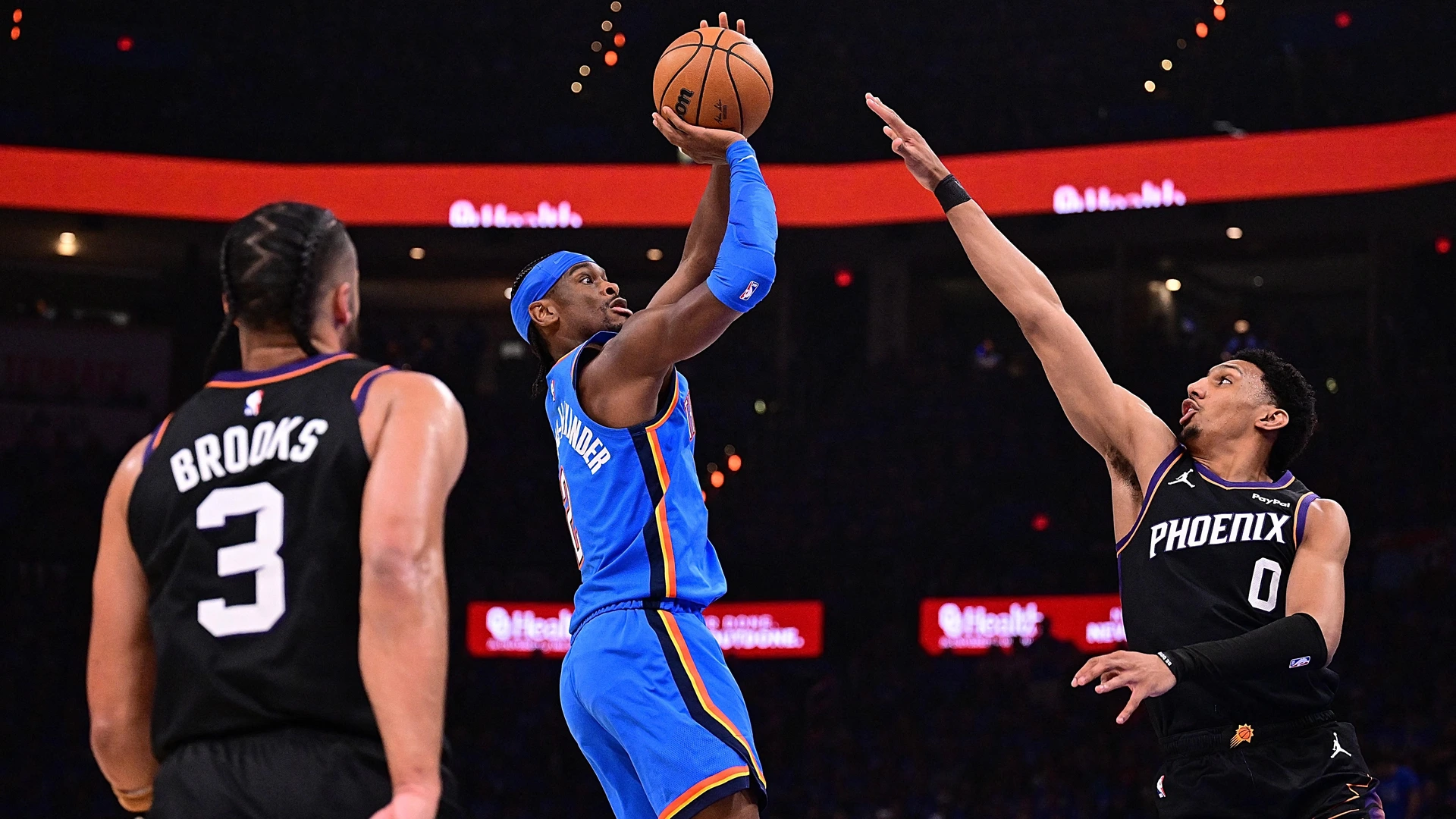Shai Gilgeous-Alexander #2 of the Oklahoma City Thunder attempts a shot in front of Ryan Dunn #0 of the Phoenix Suns during the first half in Game One of the Western Conference First Round NBA Playoffson April 19, 2026 in Oklahoma City, Oklahoma.
