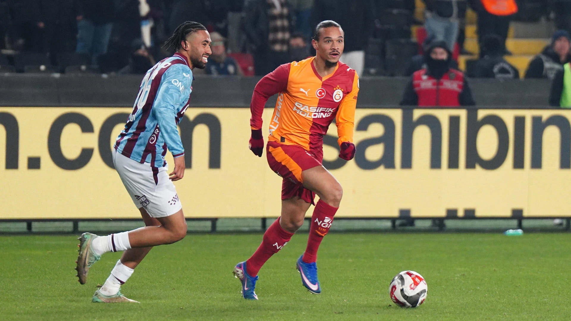 GAZIANTEP, TURKEY - JANUARY 5: Leroy Sane R of Galatasaray and Ozan Tufan L of Trabzonspor during the Turkish Super Cup Semi Final match between Galatasaray SK and Trabzonspor at Gaziantep Stadium on January 5, 2026 in Gaziantep, Turkey.