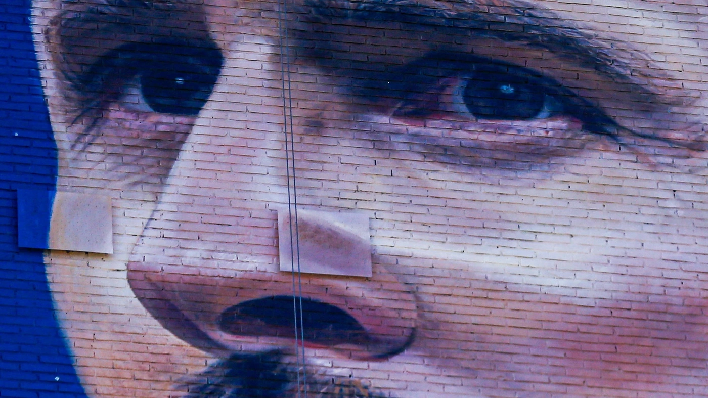 A view of a giant Lionel Messi mural created by artist Martin Ron from his series of murals called the Capitanes located on the corner of Avenida Belgrano and Avenida 9 de Julio in Buenos Aires, Argentina, on December 14, 2023