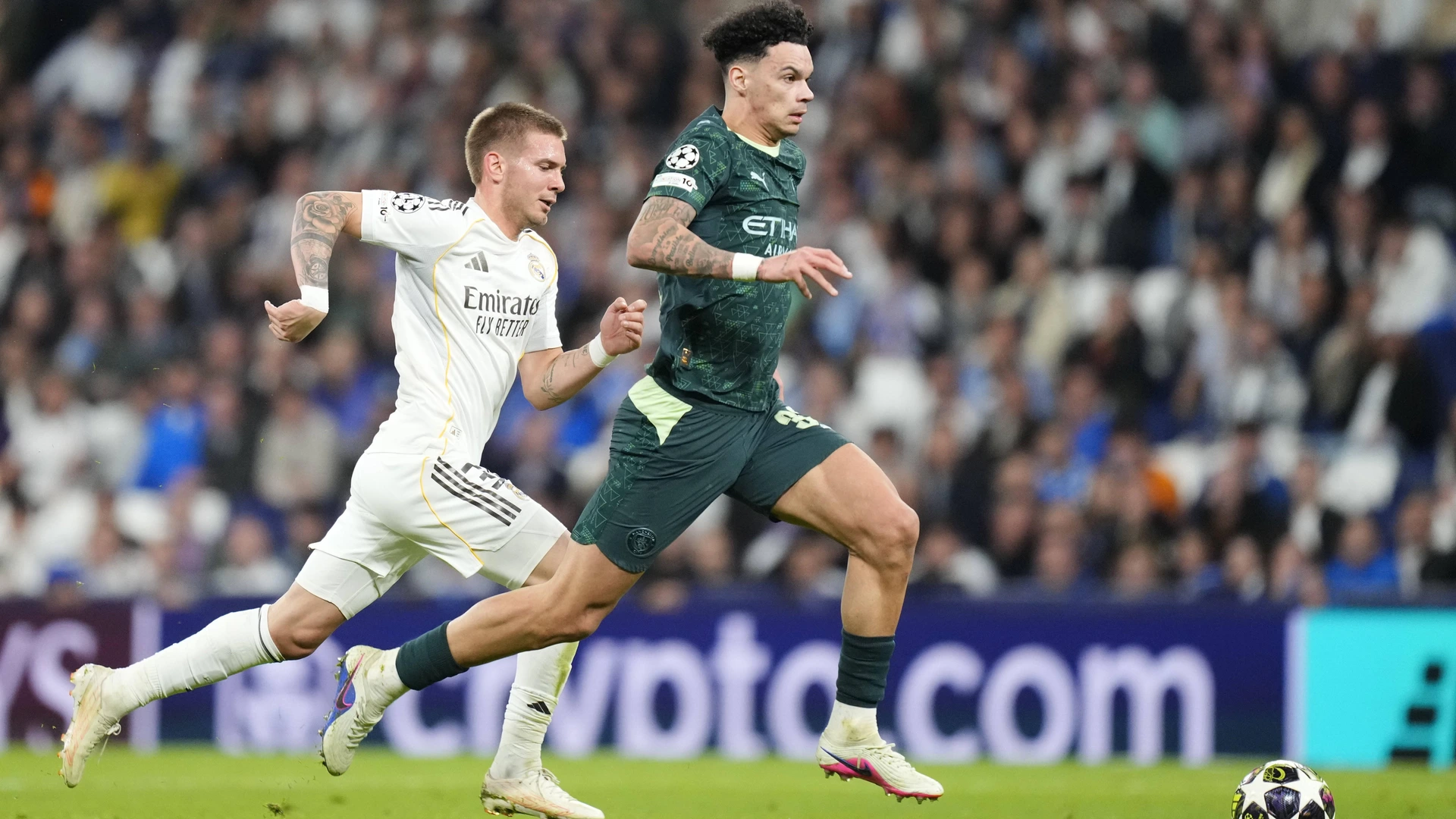 Nico O Reilly left-back of Manchester City and Franco Mastantuono compete for the ball during the UEFA Champions League 2025/26 Round of 16 First Leg match between Real Madrid CF and Manchester City FC on March 11, 2026 in Madrid, Spain.