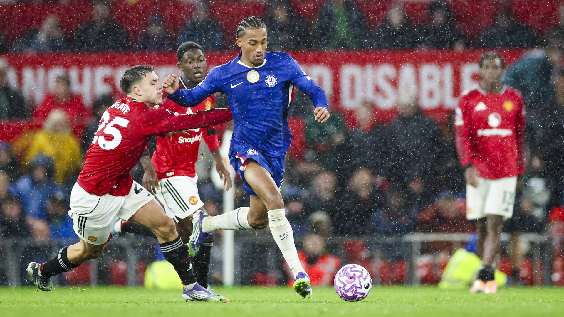 Chelsea forward Joao Pedro 20 battles with Manchester United midfielder Manuel Ugarte 25 during the Manchester United FC v Chelsea FC English Premier League match at Old Trafford, Manchester, England, United Kingdom on 20 September 2025