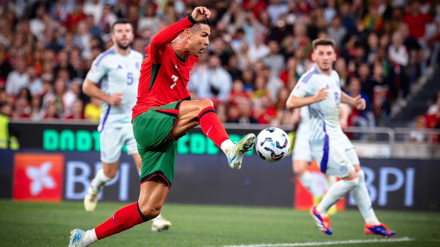 Cristiano Ronaldo scores Portugal s second goal during the match between Portugal and Scotland at Estadio da Luz, Lisbon, Portugal.