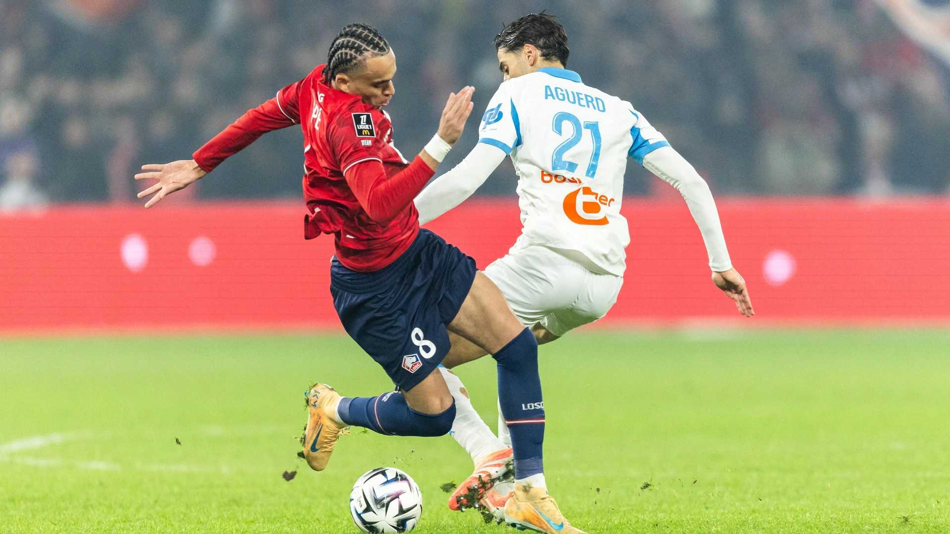Ethan Mbappe of Lille LOSC L and Nayef Aguerd of Olympique de Marseille R participate in the French L1 football match between Lille LOSC and Olympique de Marseille OM at the Pierre-Mauroy stadium in Villeneuve-d Ascq, northern France.