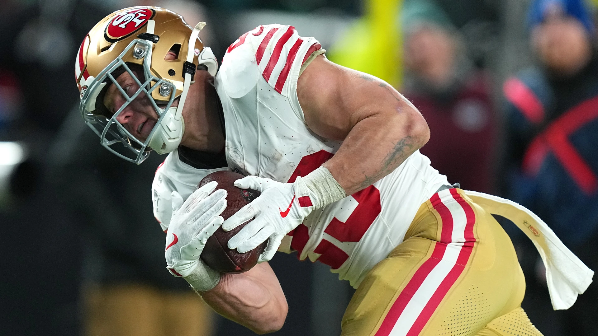Christian McCaffrey #23 of the San Francisco 49ers catches a touchdown against the Philadelphia Eagles during the fourth quarter in the NFC Wild Card Playoff game at Lincoln Financial Field on January 11, 2026