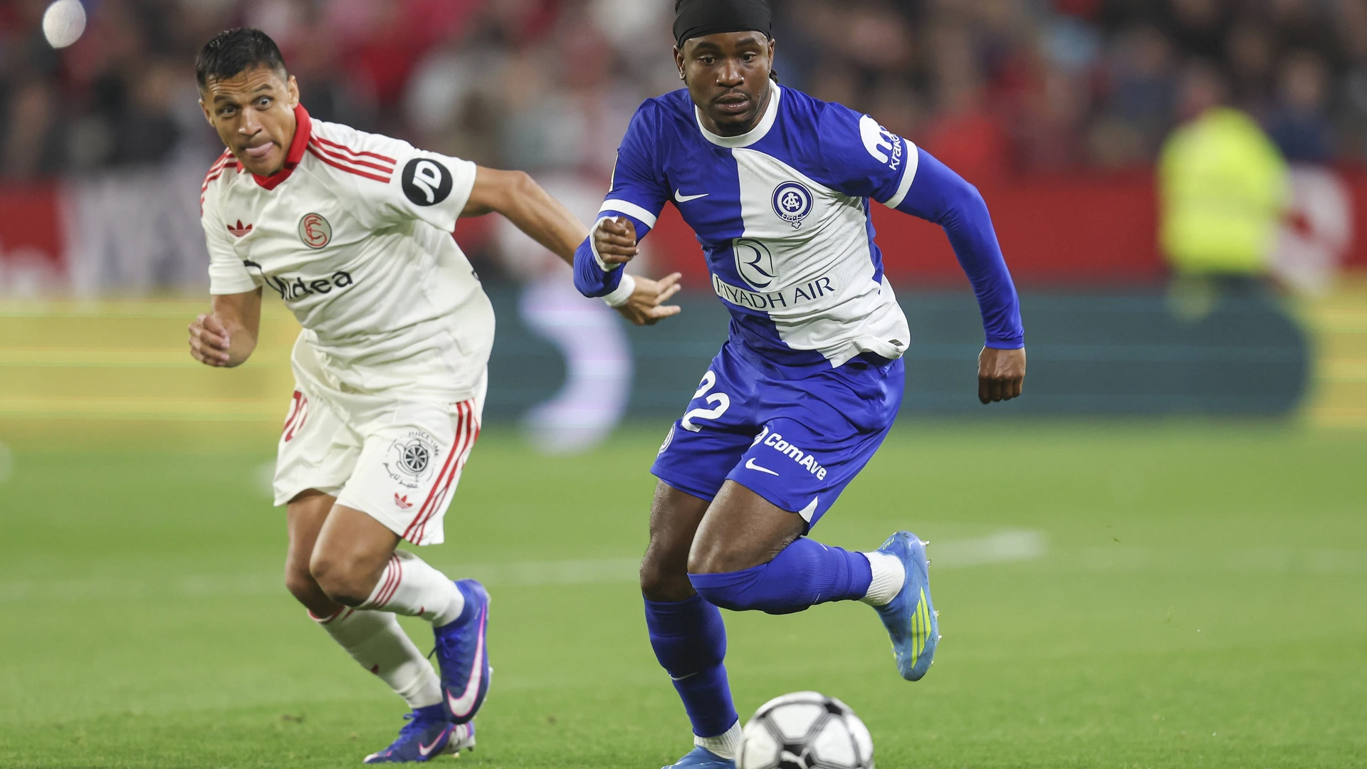 Ademola Lookman of Atletico de Madrid and Alexis Sanchez of Sevilla FC during the La Liga EA Sports match between Sevilla FC and Atletico de Madrid on April 11, 2026