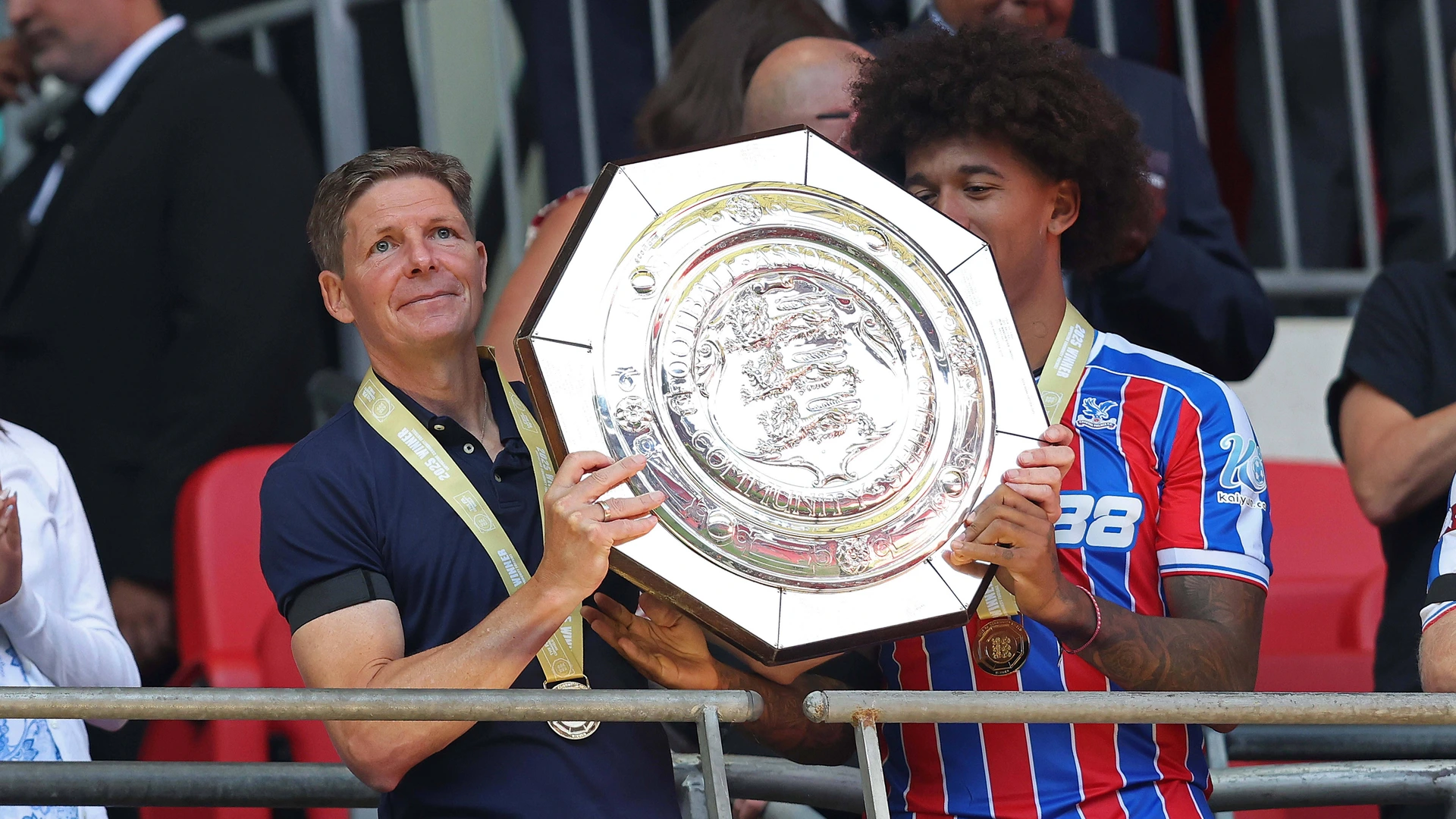 Oliver Glasner Manager of Crystal Palace holds aloft the FA Community Shield in celebration with his Crystal Palace team mates after Crystal Palace win the 2025 FA Community Shield. - Wembley Stadium, London, England. - 10th August 2025.