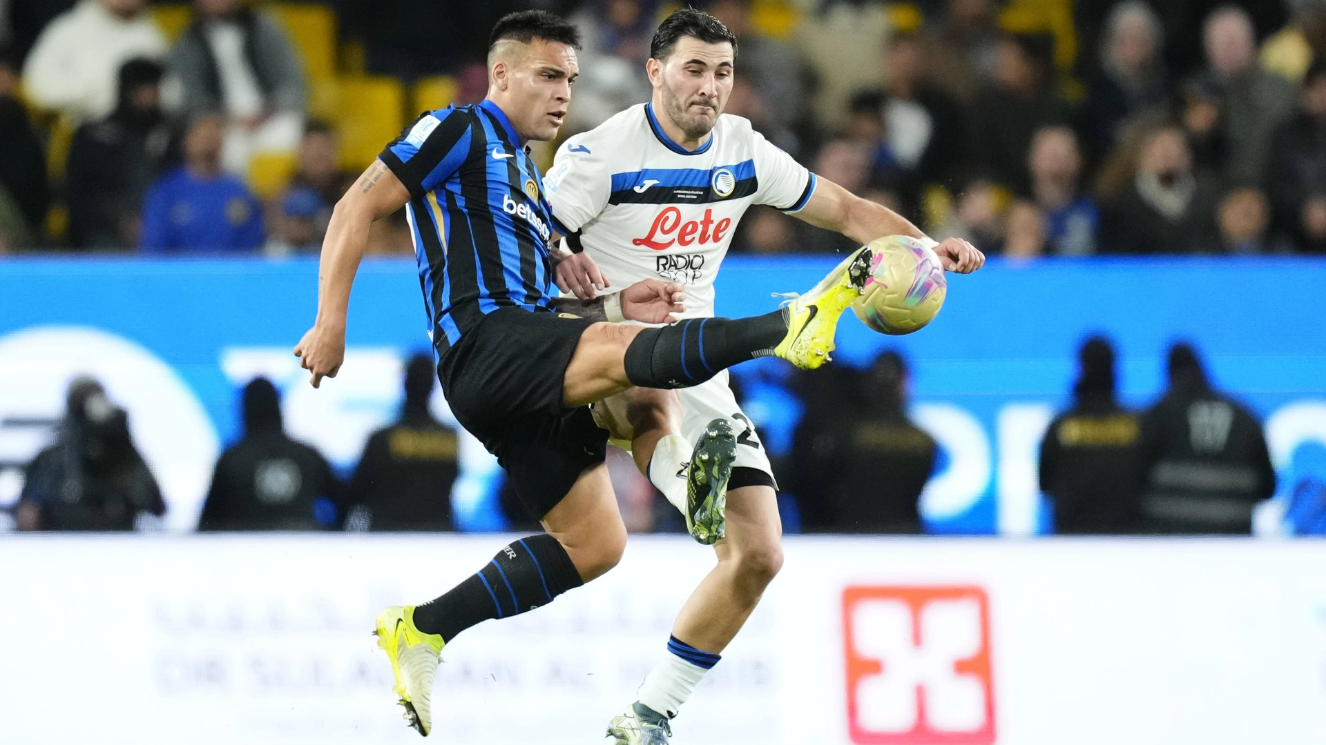 Lautaro Martinez of Internazionale and Sead Kolasinac of Atalanta compete for the ball during the EA Sports FC Supercup 24/025 semifinal match between FC Internazionale and Atalanta at Kingdom Arena on January 2, 2025 in Riyadh, Saudi Arabia.