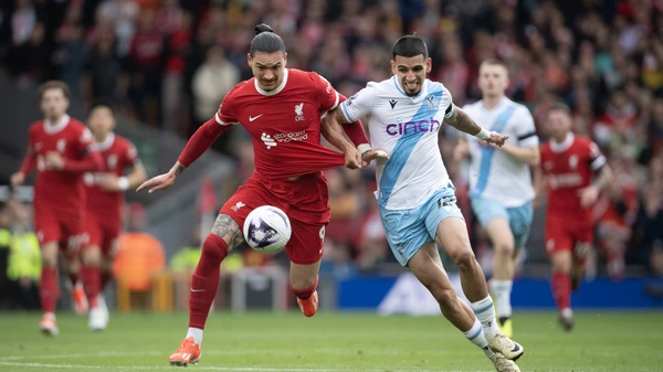 Darwin Nunez of Liverpool and Daniel Munoz of Crystal Palace in action during the Premier League match between Liverpool FC and Crystal Palace at Anfield on April 14, 2024