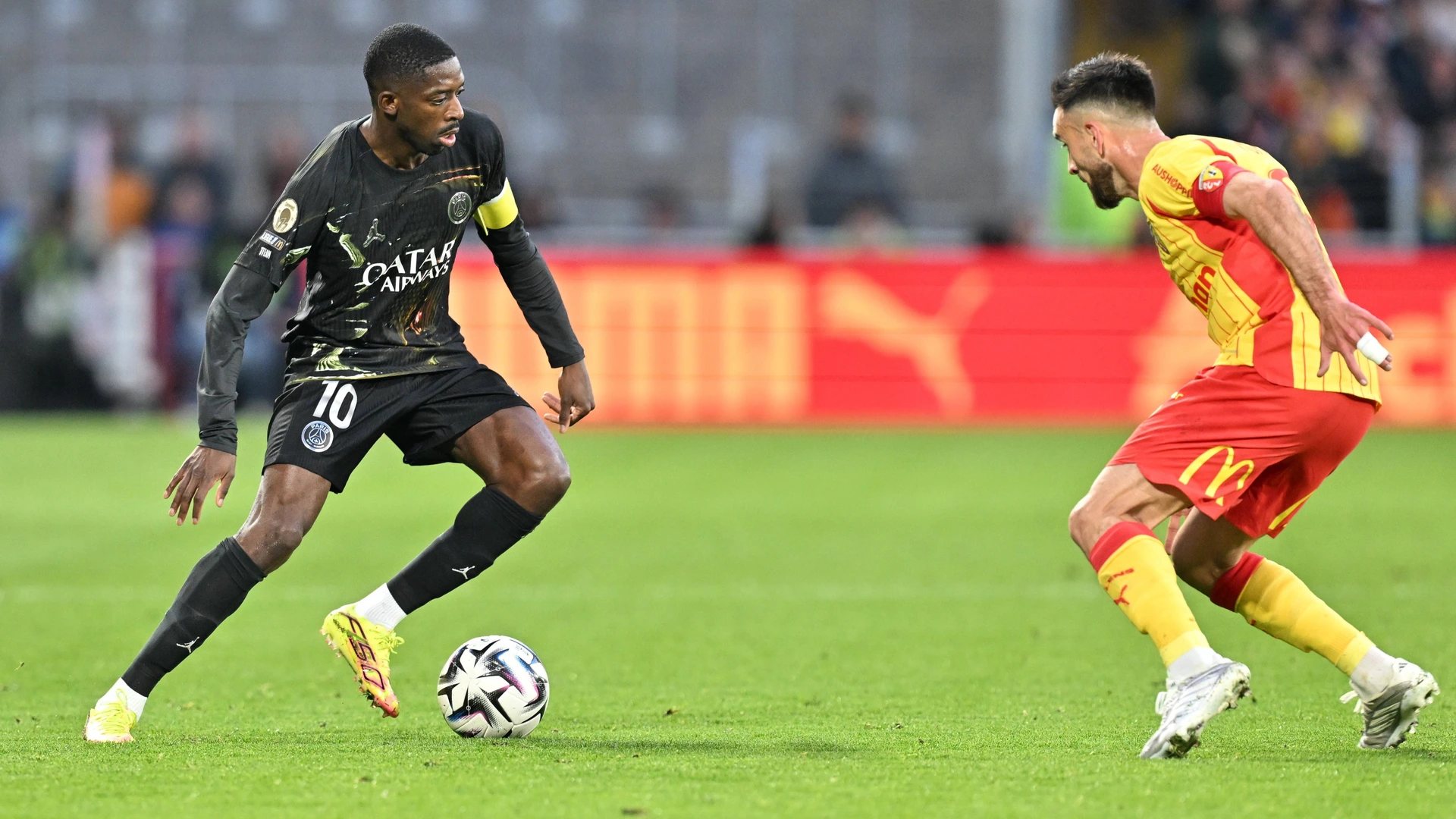 260513 RC Lens vs PSG Ousmane Dembele 10 of PSG and Adrien Thomasson 28 of RC Lens pictured during the French Mc Donalds Ligue 1 season 2025 - 2026 matchday 29 game between Racing Club De Lens and Paris Saint-Germain on May 13 , 2026 in Lens, France.