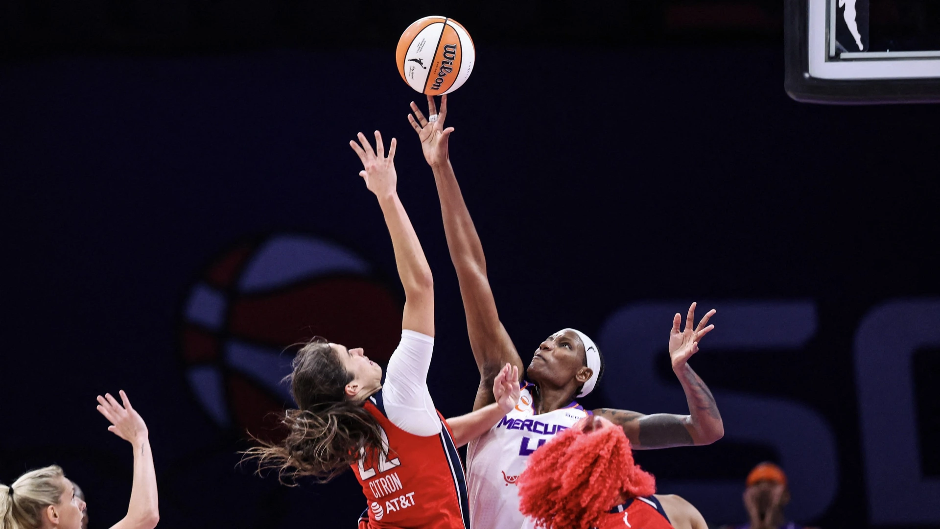 Natasha Mack #4 of the Phoenix Mercury blocks a lay up attempted by Sonia Citron #22 of the Washington Mystics at Mortgage Matchup Center on August 25, 2026