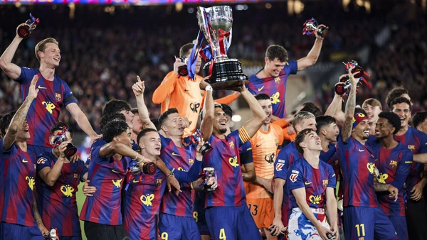 FC Barcelona players celebrate the La Liga championship with the trophy during the La Liga EA Sports 2025/26 El Clasico match between FC Barcelona and Real Madrid at Spotify Camp Nou Stadium in May 2026 in Barcelona, Spain.