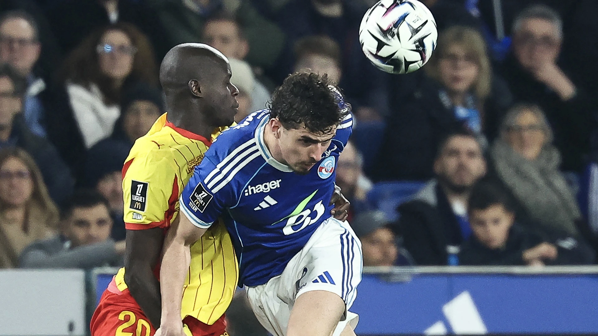 Strasbourg’s Argentine forward #09 Joaquin Panichelli (R) fights for the ball with Lens’ French defender #20 Malang Sarr during the French L1 football match between RC Strasbourg Alsace and Lens (RCL) at the Stade de la Meinau in Strasbourg, eastern France, on February 27, 2026.
