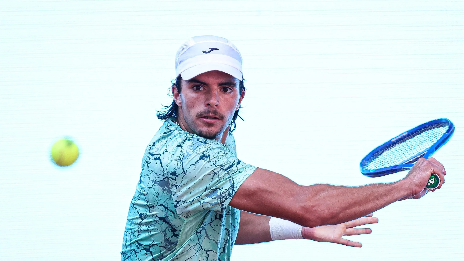 Jaime Faria of Portugal competes against Hubert Hurkacz of Poland during their Men's Singles match on Day Three of the Mutua Madrid Open at La Caja Magica in Madrid, Spain, on April 22, 2026.