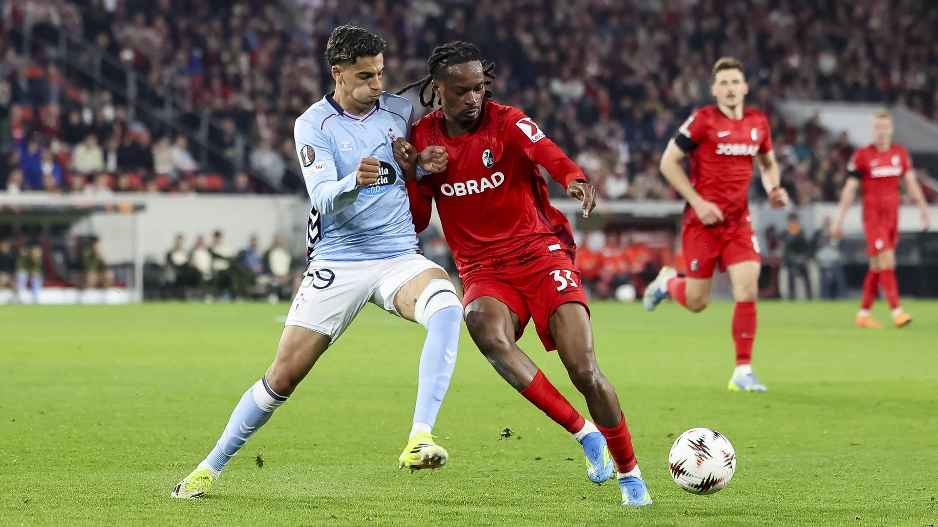 Jones El Abdellaoui Celta Vigo, 39 and Jordy Makengo SC Freiburg, 33 fighting for the ball , Germany, Football, UEFA Europa League, quarter-final, 2025 2026, SC Freiburg vs Celta Vigo, 09 04 2026