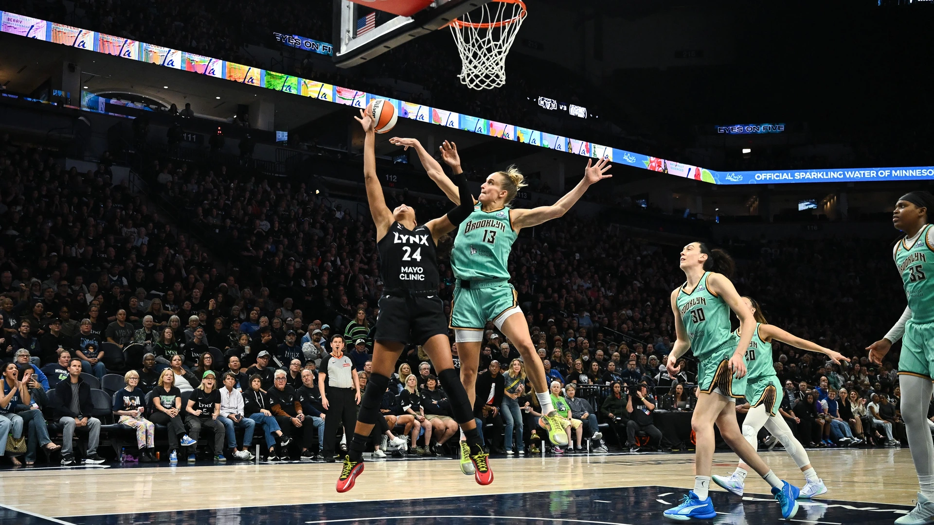 Leonie Fiebich #13 of the New York Liberty blocks a shot by Napheesa Collier #24 of the Minnesota Lynx during the third quarter of Game One of the first round of the WNBA Playoffs at Target Center on September 27, 2026