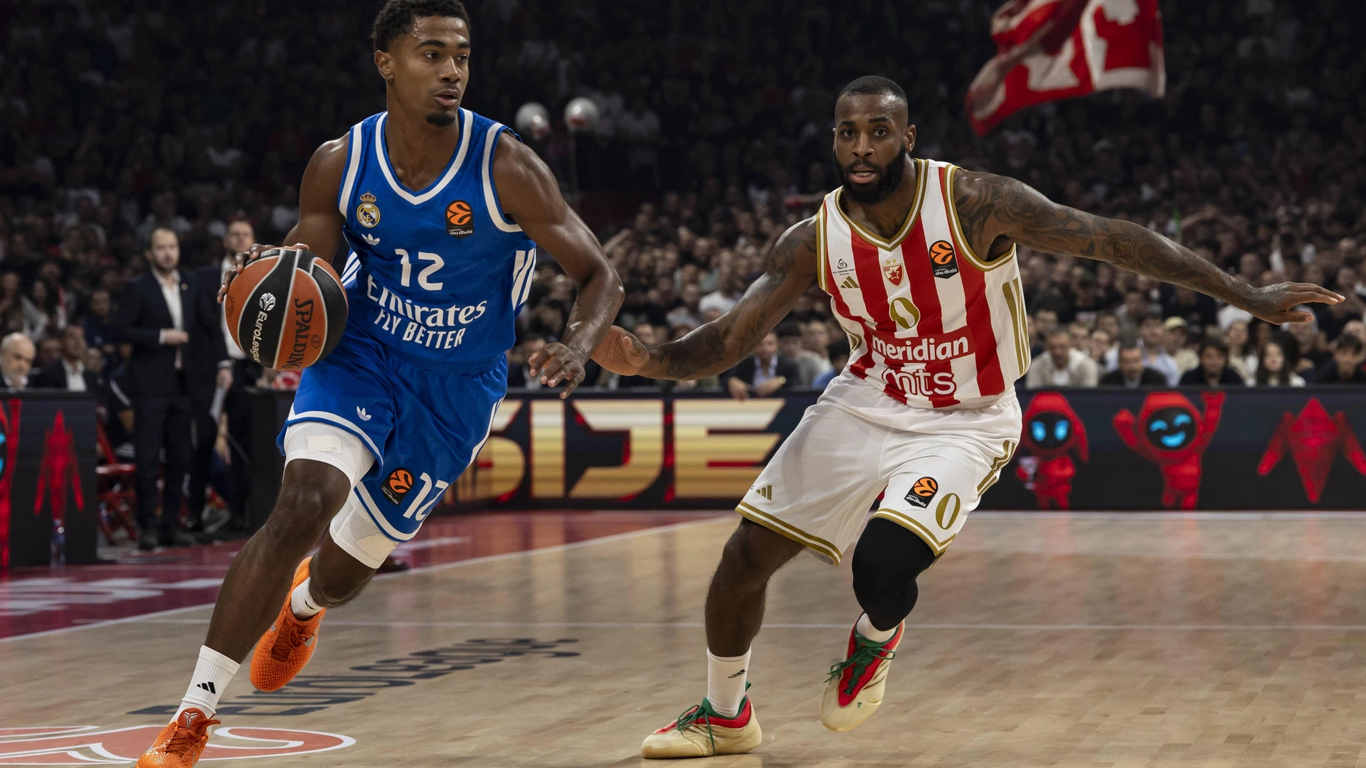 Theo Maledon, 12 of Real Madrid in action against Codi Miller-McIntyre, 0 of Crvena Zvezda Meridianbet Belgrade during 2025/2026 EuroLeague Round 5 match between Crvena Zvezda and Real Madrid at Belgrade Arena on October 17, 2025 in Belgrade, Serbia.