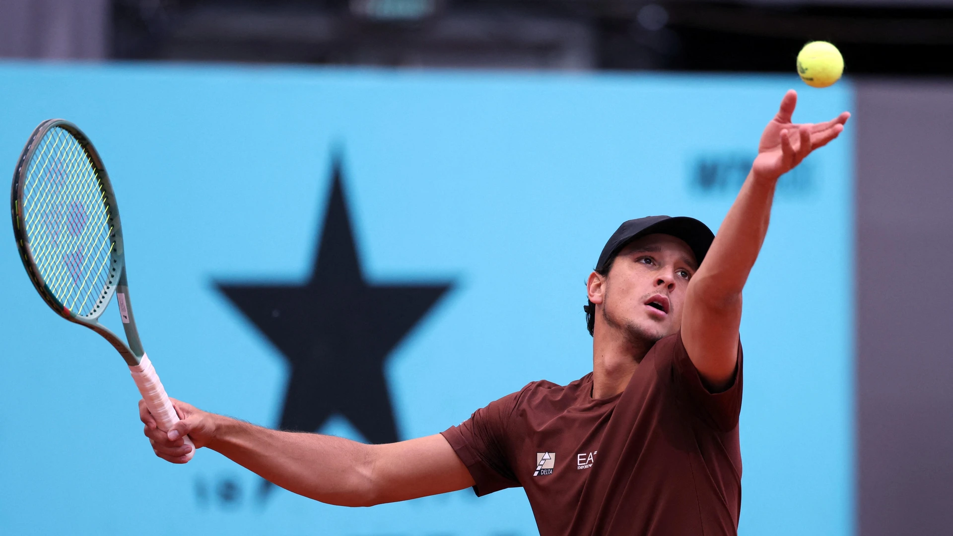Italy’s Luciano Darderi serves the ball to US' Frances Tiafoe during their 2025 ATP Tour Madrid Open tennis tournament second round singles match at the Caja Magica in Madrid, on April 26, 2025.