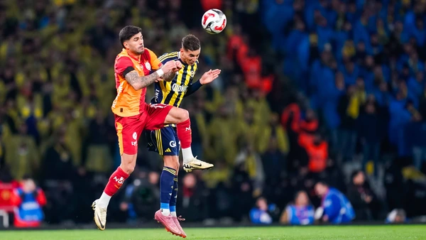 Mert Mulduer of Fenerbahce is in action with Evren Eren Elmali of Galatasaray during the Super Cup final between Galatasaray and Fenerbahce at the Ataturk Olympic Stadium in Istanbul, Turkey, on January 10, 2026.
