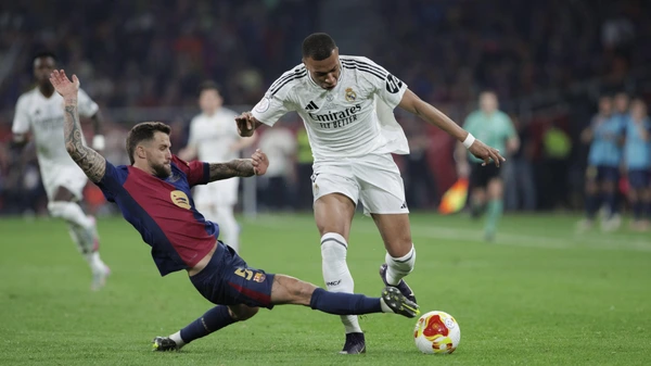 Kylian Mbappe of Real Madrid and Igo Martinez of Barcelona in action during the 2024/25 Copa del Rey final match