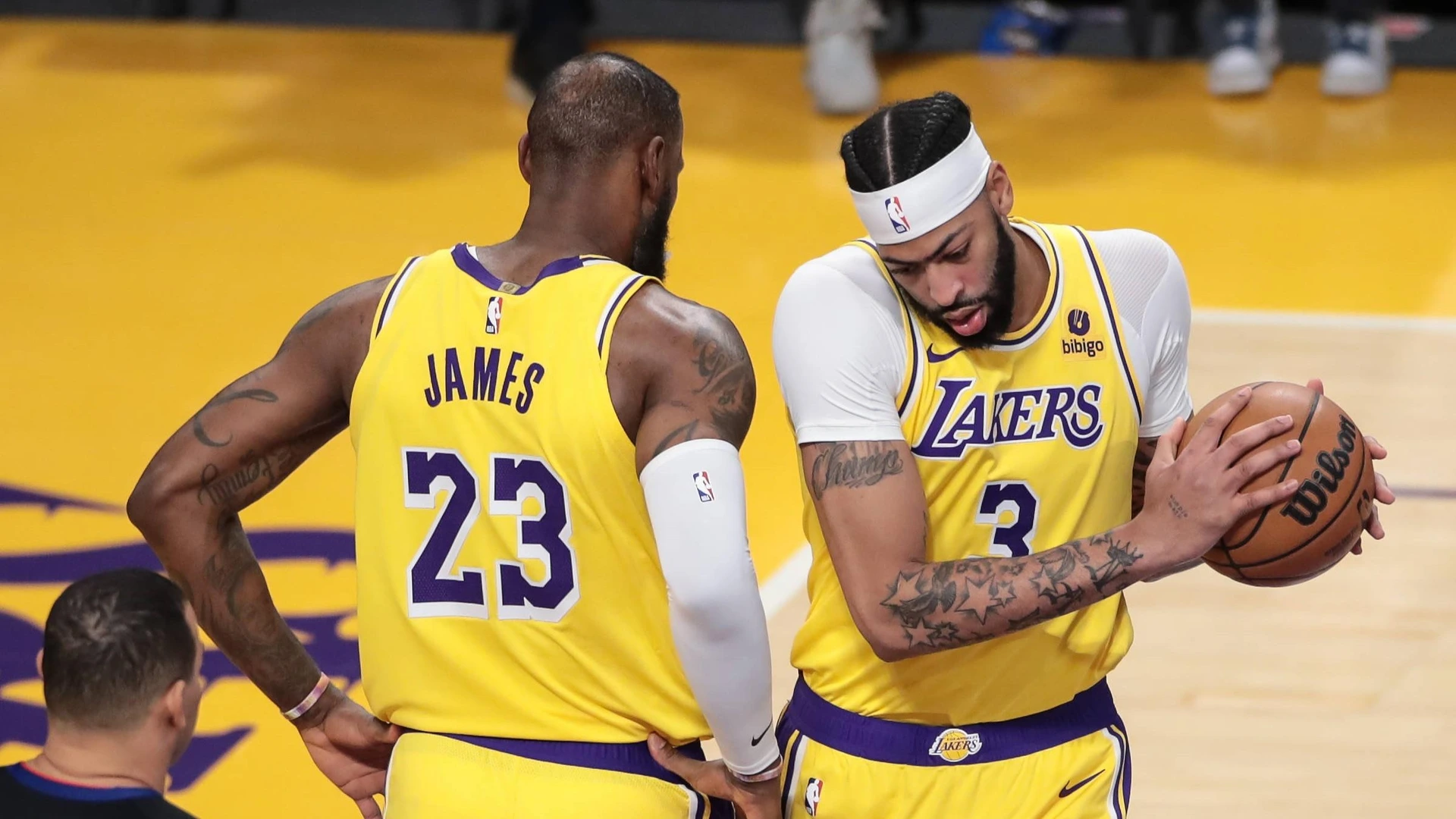 LOS ANGELES, CA - JANUARY 03: Miami Heat guard Jaime Jaquez Jr. 11 dunks under Los Angeles Lakers forward LeBron James 23 during the NBA game between the Miami Heat and the Los Angeles Lakers on January 03, 2024.