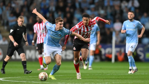 Jobe 7 Sunderland challenges Ben Sheaf 14 Coventry City during the Sky Bet Championship Play Off Semi Final match between Coventry City and Sunderland at the Coventry Building Society Arena in Coventry, on May 9, 2025.